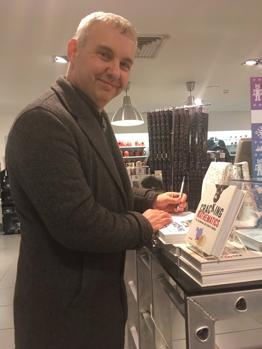 Colin signing copies of Cracking Mathematics at the Science Museum in London